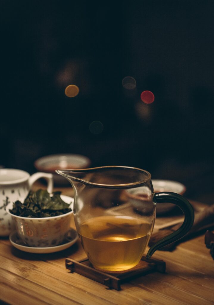 A warm, inviting tea setup on a wooden table, captured beautifully with soft bokeh in the background.